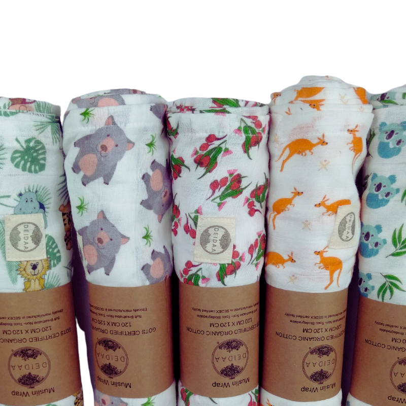 Wrap your baby in pure comfort with our GOTS certified organic cotton muslin swaddle. Ethically made and toxin-free, our breathable swaddle is perfect for newborns. Five designs on white background.
