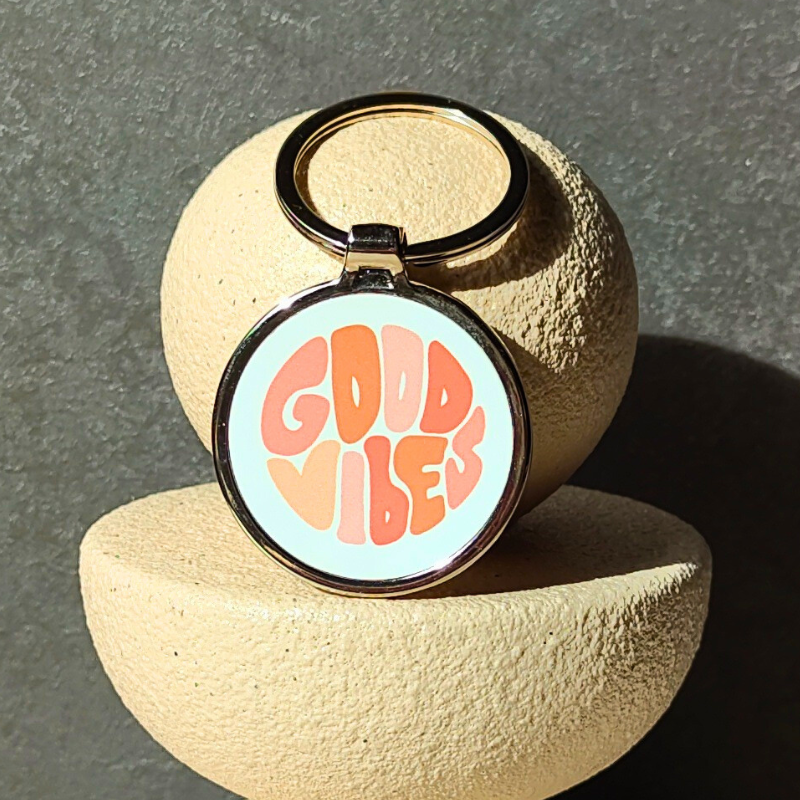 Round metal keyring with affirmation good vibes keyring.