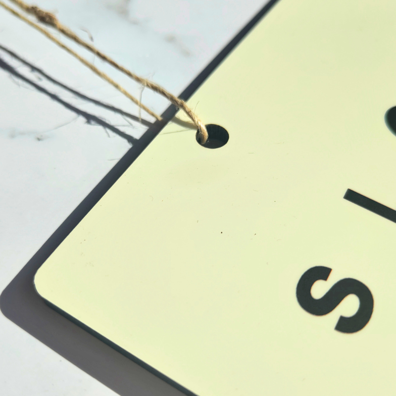 Hanging door sign with jute twine hanger.