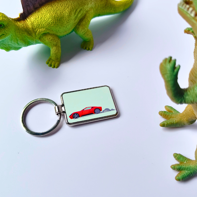 Cartoon printed racecar metal keyring.