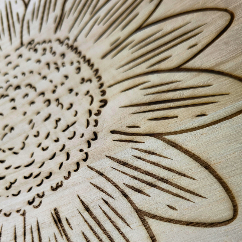 Round wooden sunflower plaque with laser engraved sunflower design.