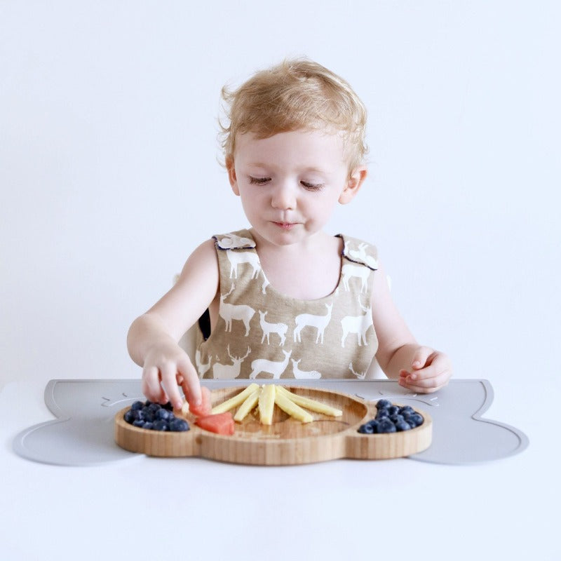 Karri Koala Toddler Feeding Plate: where sustainability meets creativity.  Boy eating fruit from divider plate