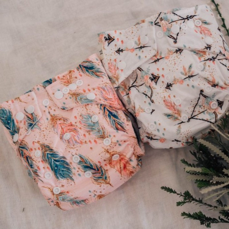 Switch to eco-friendly Modern Cloth Nappies (MCNs) for babies. Feathers and Arrows designs.