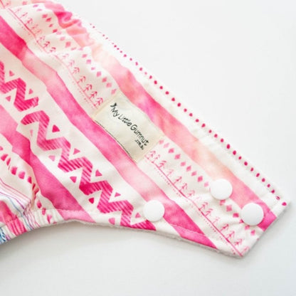 Switch to eco-friendly Modern Cloth Nappies (MCNs) for babies. Close-up of snaps.