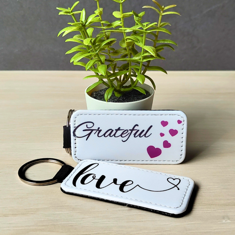 Vegan leather keyrings with cute positive affirmation prints.