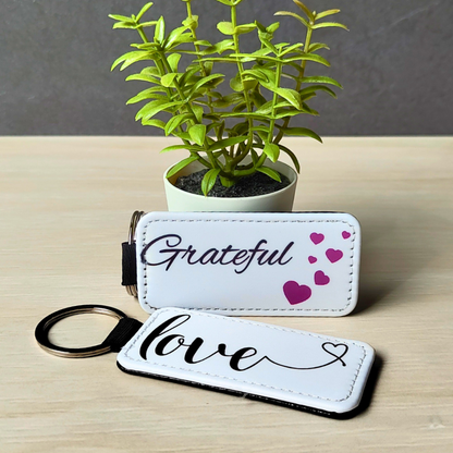 Vegan leather keyrings with cute positive affirmation prints.