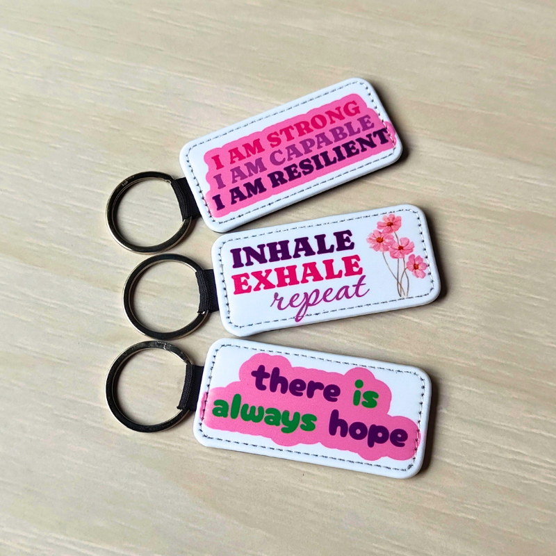 Affirmation vegan leather printed keyrings. Pink keyrings under $10.