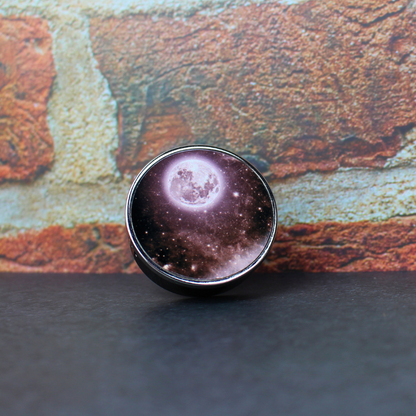 Black oud scented car air freshener with starry moon print.