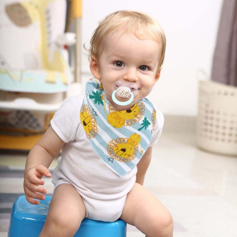 100% organic cotton triangle dribble bibs. Baby with dummy wearing triangle dribble bib.