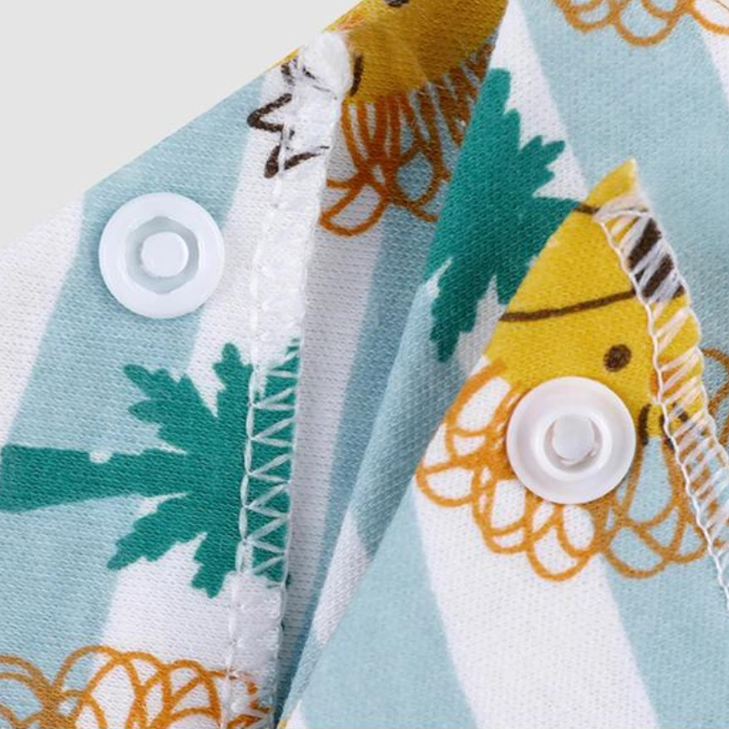 100% organic cotton triangle dribble bibs. Close up of snap buttons.