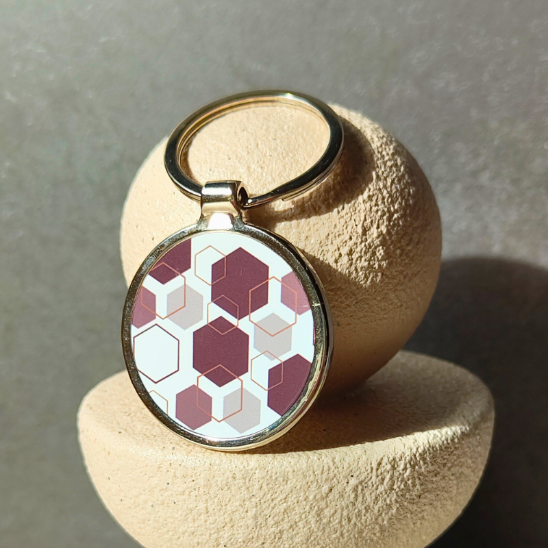 Brown Geometric shapes patterned round metal keyring.