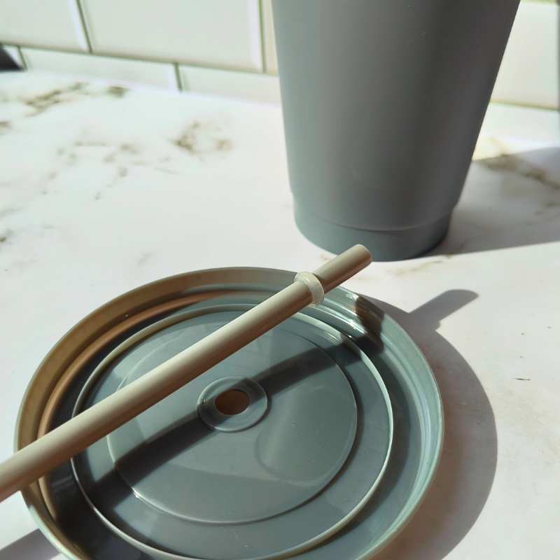 Reusable cup with lid and straw.