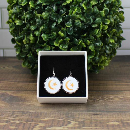 Close-up moon and star printed design on earrings