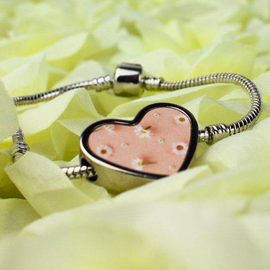 Daisy printed charm with silver charm bracelet.