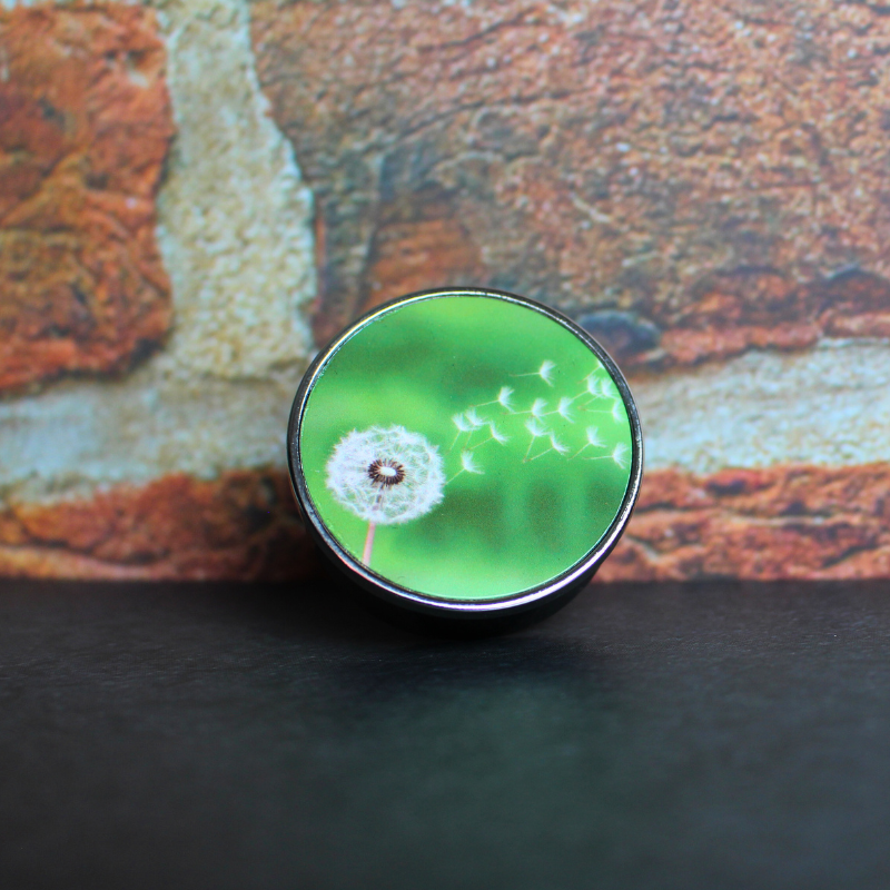 Car air freshener with cute dandelion print and sweet orchid scent. Refillable and reusable.