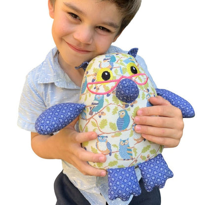 Discover our collection of handmade Organic and Eco-Friendly Stuffed Owl Toys. Boy holding Owl toy.