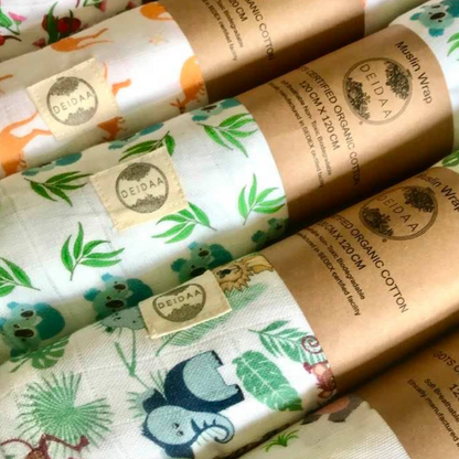 Wrap your baby in pure comfort with our GOTS certified organic cotton muslin swaddle. Ethically made and toxin-free, our breathable swaddle is perfect for newborns. All designs displayed rolled up in a row