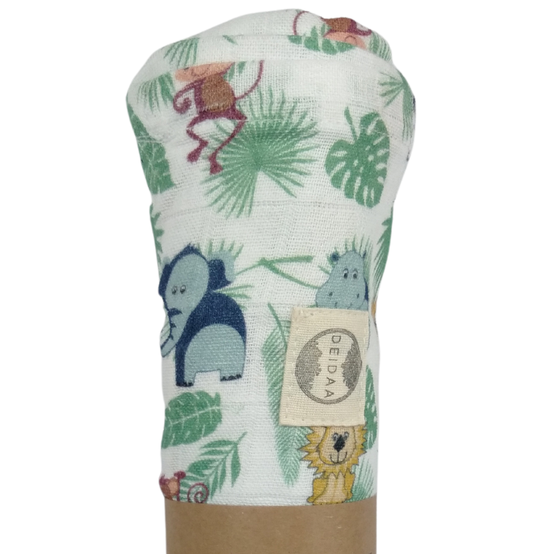 Wrap your baby in pure comfort with our GOTS certified organic cotton muslin swaddle. Ethically made and toxin-free, our breathable swaddle is perfect for newborns. Jungle Animal design on white background.