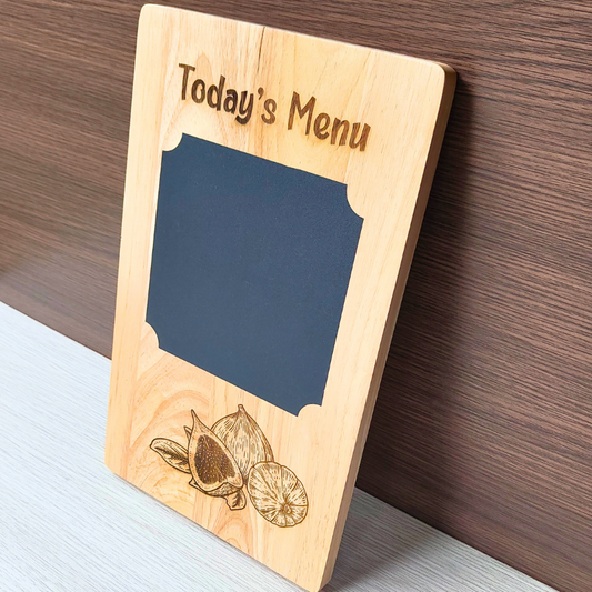 Wooden kitchen board with menu blackboard and engraved figs design.