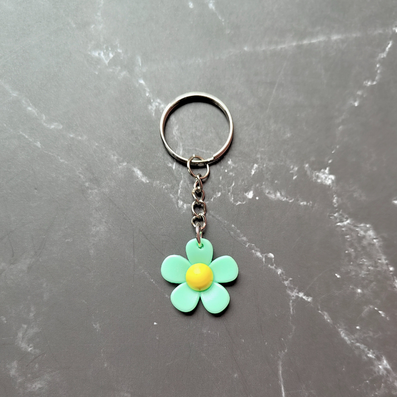 PVC green and yellow flower keyring.