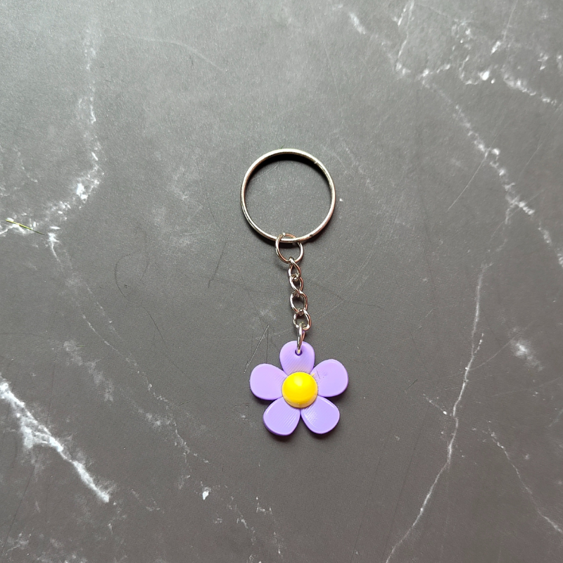 Purple and yellow flower keyring made from sturdy PVC.
