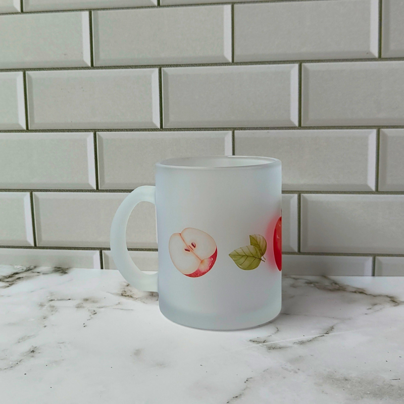 Frosted glass cup with apples print for teachers.