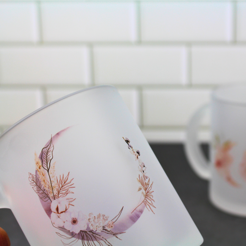 Frosted glass cup with flower crescent moon print.