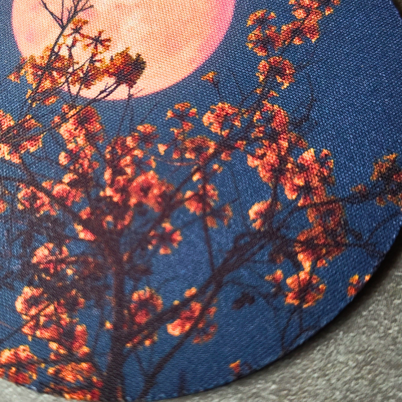 Full moon printed non-slip rubber backed drink coaster.