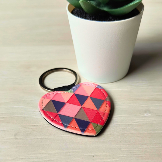 PU vegan leather heart shaped keyring with geometric triangles print.