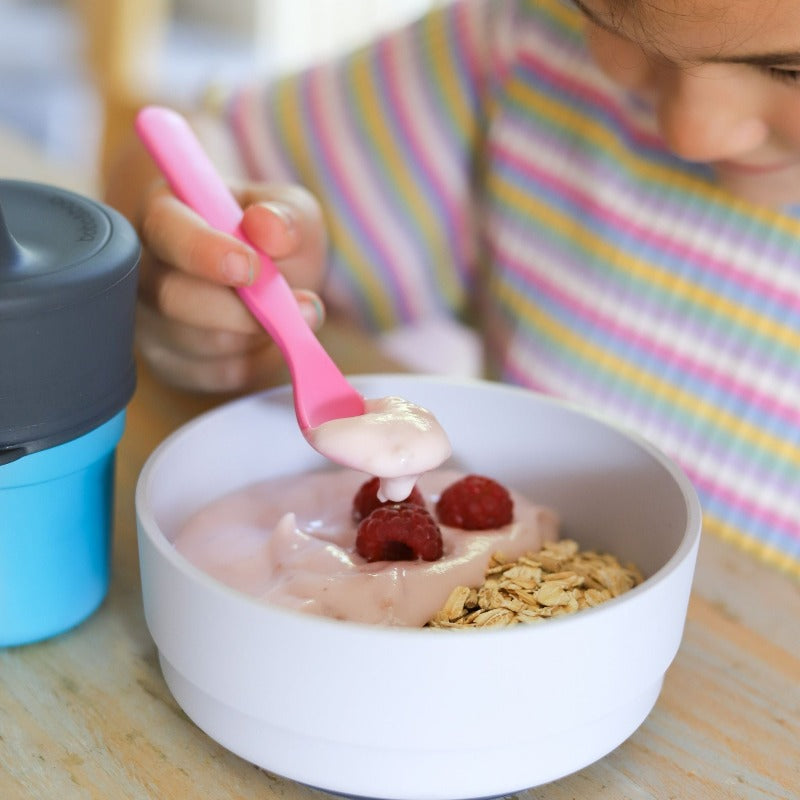 Free from melamine, and biodegradable and compostable, our plant-based spoon and fork cutlery set makes mealtimes (and sneaky snacks) way more fun! Pink spoon lifestyle image