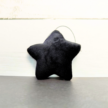 Hanging soft star with string in black.