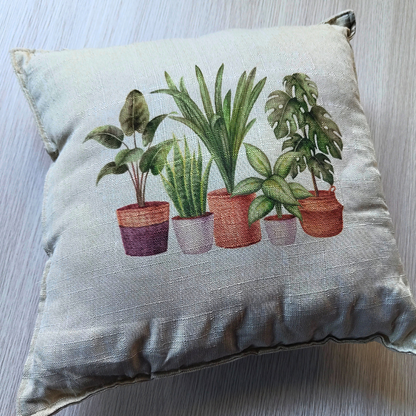 Cream coloured decorative statement cushion with houseplants print.