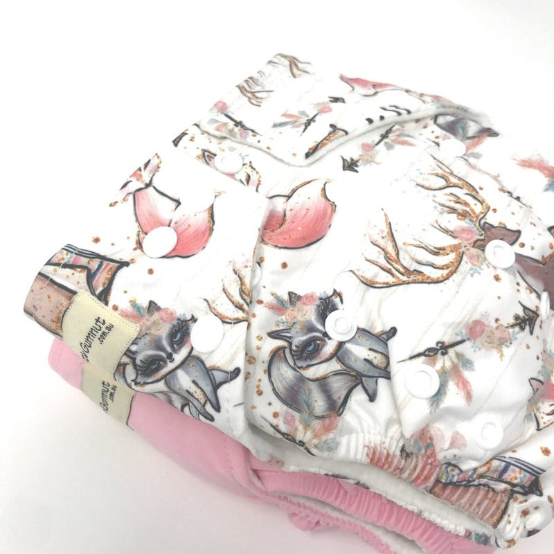 Switch to eco-friendly Modern Cloth Nappies (MCNs) for babies. 2 designs displayed on white background.