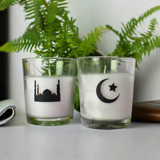 Small candle in glass jar with Islamic designs.