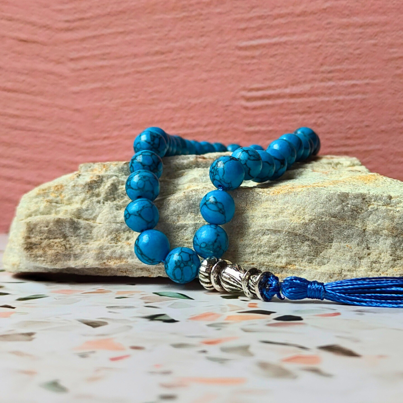 Blue stone-look Islamic prayer beads, 33 count with blue tassel.