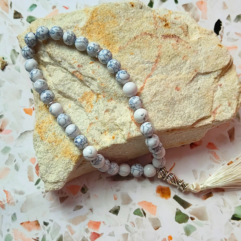 White stone 33 bead Islamic prayer beads with white tassel.