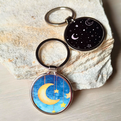 Round metal Islamic printed moons and stars keyrings.
