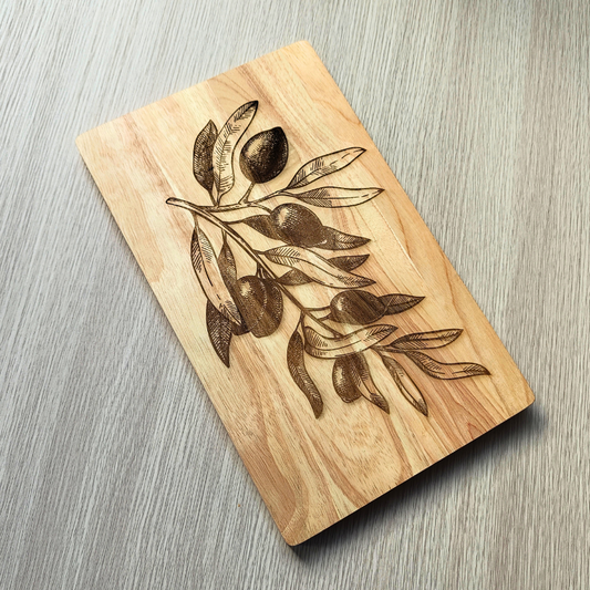Kitchen wooden board with decorative olives and olive branch laser engraved design.