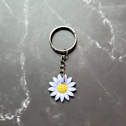 Light blue and yellow sunflower keyring.