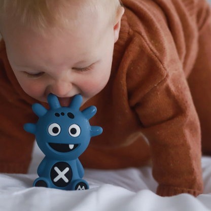 Mibblers Silicone Teether - 100% Latex-Free, Safe, and Adorable Teething Toy. Child playing with Blue Mibbler.