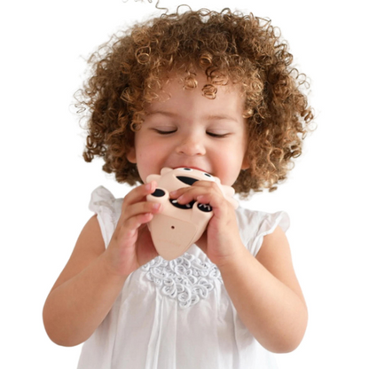 Mibblers Silicone Teether - 100% Latex-Free, Safe, and Adorable Teething Toy. Child playing with Dusty Pink Mibbler.