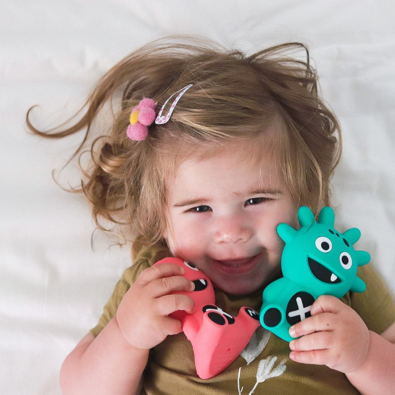 Mibblers Silicone Teether - 100% Latex-Free, Safe, and Adorable Teething Toy. Child playing with Mibblers.
