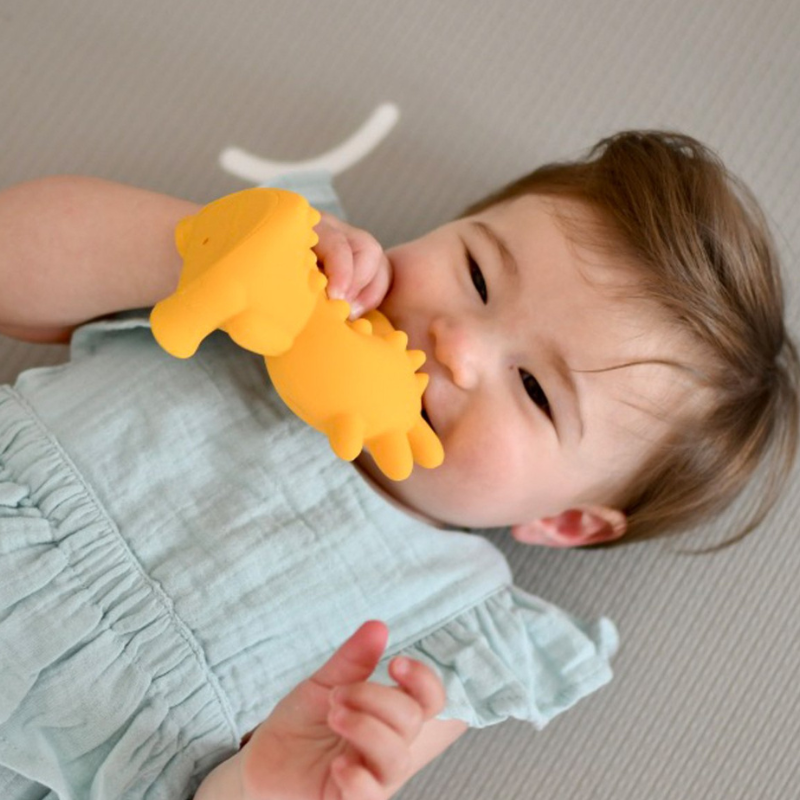 Mibblers Silicone Teether - 100% Latex-Free, Safe, and Adorable Teething Toy. Child playing with Yellow Mibbler.