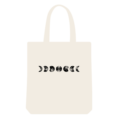 Reusable shopping tote bag with floral black moon phases print. Eco-friendly and sustainable bag.