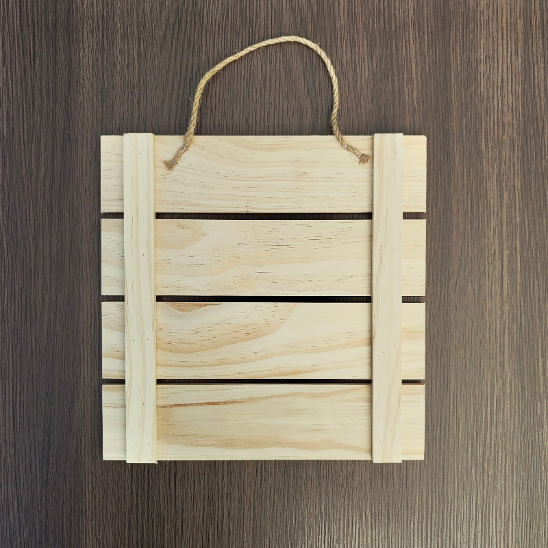 Back view of handmade pine wood affirmation wall sign showing hanging fixture and natural wood finish