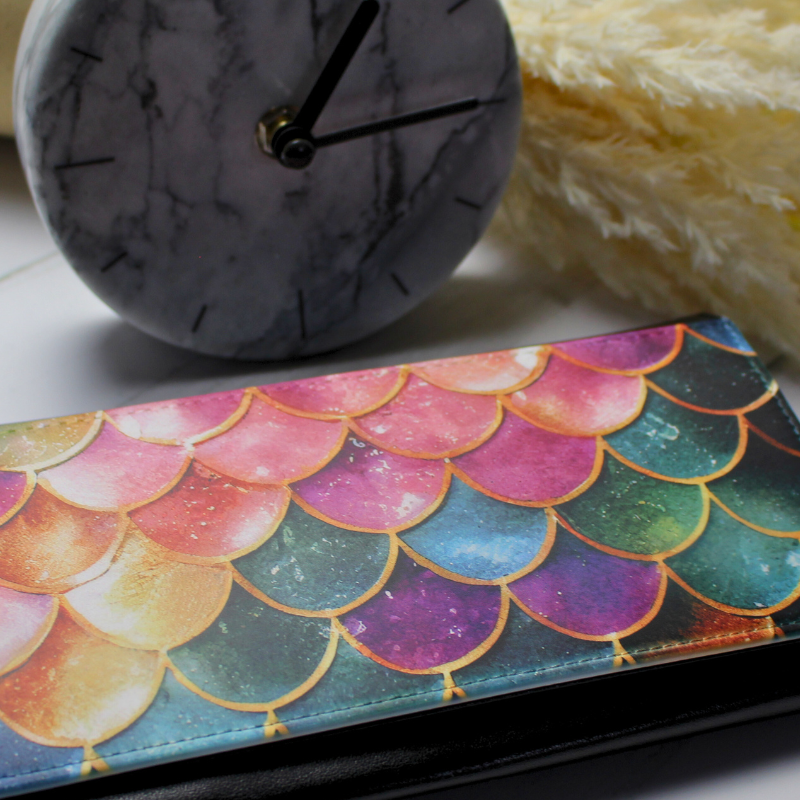 Vegan leather purse with mermaid gem-style scales with clock and flowers background