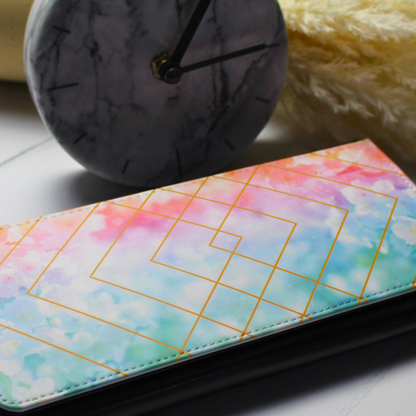 Vegan leather purse with pastel geo shapes with clock and floral background
