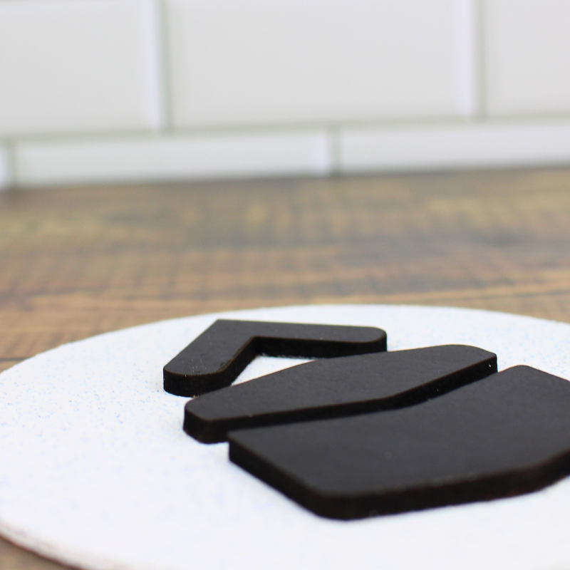 Modern qibla directional arrow. Wooden with raised wood arrows.