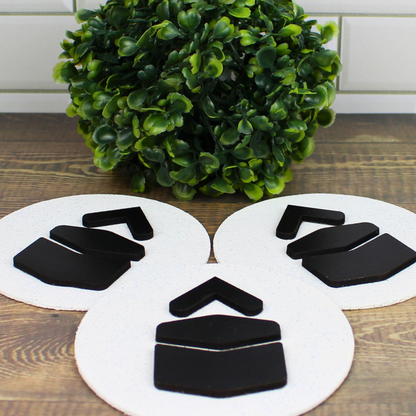 Qibla directional signs with plywood and stone finish, raised wooden arrows and Kaaba design.