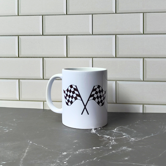 Ceramic coffee mug with checkered racing flags print.